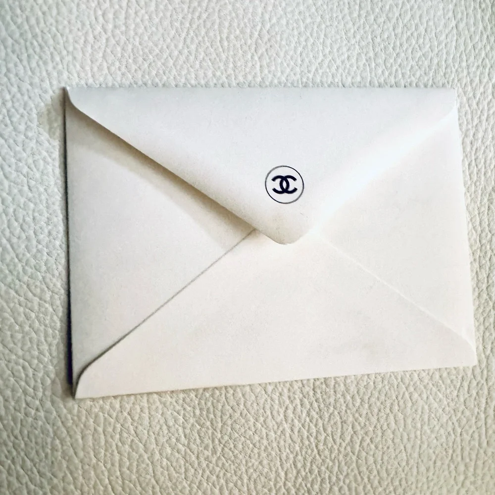 Chanel Receipt holders in camelia and black and an envelope